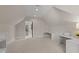 Open bonus room with carpeted flooring, built-in desk, and access to other rooms at 2710 Cambridge Rd, Raleigh, NC 27608