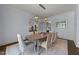 Elegant dining room with sophisticated lighting, dining table and stylish chairs at 2710 Cambridge Rd, Raleigh, NC 27608
