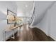 Bright foyer with hardwood flooring and curved staircase at 2710 Cambridge Rd, Raleigh, NC 27608