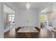 Grand foyer with hardwood floors, chandelier, and double doors at 2710 Cambridge Rd, Raleigh, NC 27608