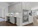 Modern kitchen with built-in oven, wine cooler, and seamless transition to living room at 2710 Cambridge Rd, Raleigh, NC 27608