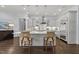 Well-appointed kitchen with large island, stainless steel appliances, and modern lighting at 2710 Cambridge Rd, Raleigh, NC 27608
