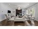 Bright living room showcasing a modern fireplace, neutral color palette, and ample natural light at 2710 Cambridge Rd, Raleigh, NC 27608