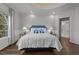 Bright bedroom features a tray ceiling, large windows, and access to an ensuite bathroom at 2710 Cambridge Rd, Raleigh, NC 27608