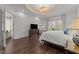 Inviting main bedroom featuring ample natural light, hardwood floors, and neutral decor at 2710 Cambridge Rd, Raleigh, NC 27608