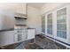 Outdoor kitchen featuring a built-in grill, counter space, and a door to the indoor space at 2710 Cambridge Rd, Raleigh, NC 27608