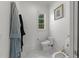 Stylish powder room featuring a toilet, bidet, and a modern vanity with elegant fixtures at 2710 Cambridge Rd, Raleigh, NC 27608