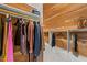 Custom walk-in closet featuring cedar paneling, shelving, and rod space for clothes and storage at 2710 Cambridge Rd, Raleigh, NC 27608