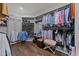 Spacious walk-in closet with custom shelving, hanging racks, and shoe storage for organized elegance at 2710 Cambridge Rd, Raleigh, NC 27608