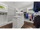 Bright walk-in closet featuring a central island, ample shelving, and hanging space, perfect for wardrobe organization at 2710 Cambridge Rd, Raleigh, NC 27608