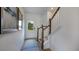 Bright entryway with a view to the front door, stairs and artwork at 272 Hank Way, Angier, NC 27501