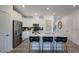 Bright kitchen features stainless steel appliances, white cabinets, and a stylish backsplash at 272 Hank Way, Angier, NC 27501