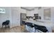Bright kitchen features stainless steel appliances, white cabinets, and a stylish backsplash at 272 Hank Way, Angier, NC 27501