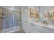 A modern bathroom featuring a glass shower, white vanity, and stylish decor at 280 Hank Way, Angier, NC 27501