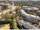 Aerial view of a community with well-maintained buildings, lush greenery and a street nearby at 2820 Glenwood Gardens Ln # 101, Raleigh, NC 27608