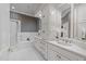 Bright bathroom with double vanity, soaking tub, and a separate shower at 2820 Glenwood Gardens Ln # 101, Raleigh, NC 27608