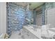 The powder room features vanity, toilet, tile floor, vanity mirror and unique blue toile wallpaper at 2820 Glenwood Gardens Ln # 101, Raleigh, NC 27608