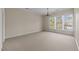 Spacious bedroom with neutral walls, carpet, shuttered windows and chandelier at 2820 Glenwood Gardens Ln # 101, Raleigh, NC 27608