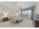 Spacious primary bedroom with a decorative window and neutral decor at 2820 Glenwood Gardens Ln # 101, Raleigh, NC 27608