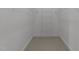 A walk-in closet is set up with a wire shelving system and neutral carpet at 2820 Glenwood Gardens Ln # 101, Raleigh, NC 27608