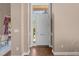 Inviting entryway features wood floors, a transom window, and a full view glass door at 2820 Glenwood Gardens Ln # 101, Raleigh, NC 27608