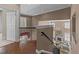 Inviting foyer overlooking the living room with hardwood floors and wrought iron railing at 2820 Glenwood Gardens Ln # 101, Raleigh, NC 27608