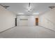 Clean garage space with white built-in storage cabinets at 2820 Glenwood Gardens Ln # 101, Raleigh, NC 27608