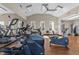 Community gym featuring treadmills, elliptical machines and an exercise bicycle in a room with wood floors and a ceiling fan at 2820 Glenwood Gardens Ln # 101, Raleigh, NC 27608