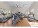 Well-lit gym with wood floors and mirrors, stocked with treadmills, elliptical, bicycle and various exercise machines at 2820 Glenwood Gardens Ln # 101, Raleigh, NC 27608