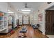 A well-equipped home gym with weights, machines, mirrors, and hardwood flooring at 2820 Glenwood Gardens Ln # 101, Raleigh, NC 27608