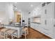 Spacious kitchen featuring white cabinets, a center island with seating, and modern appliances at 2820 Glenwood Gardens Ln # 101, Raleigh, NC 27608