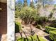 Charming brick patio surrounded by manicured greenery, offering a private outdoor space at 2820 Glenwood Gardens Ln # 101, Raleigh, NC 27608