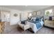 Elegantly designed bedroom showcases calming blue hues, two windows, and sophisticated decor touches at 284 Hank Way, Angier, NC 27501