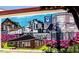 Colorful mural depicting a train and buildings in downtown Angier at 284 Hank Way, Angier, NC 27501