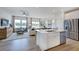 Open-concept living space connects the kitchen and living room, enhancing the home's spacious feel and natural light at 284 Hank Way, Angier, NC 27501