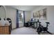 Home office space featuring a modern desk setup, comfortable seating, and exercise equipment at 284 Hank Way, Angier, NC 27501