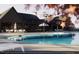 Relaxing poolside view with lounge chairs and umbrellas by the community clubhouse at 3012 Dog Rose Dr # 305, Durham, NC 27703