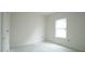 Bright bedroom with a single window and a closet for efficient storage at 303 E C St, Butner, NC 27509