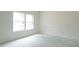 Bright bedroom illuminated by two windows that provide ample natural light at 303 E C St, Butner, NC 27509
