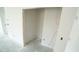 Walk-in closet with an accessible space, ideal for storage solutions and organization at 303 E C St, Butner, NC 27509