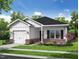 Charming single-story home with white siding, brick accents, landscaped yard and an attached garage at 303 E C St, Butner, NC 27509