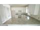 A bright kitchen featuring gray countertops and white cabinets at 303 E C St, Butner, NC 27509