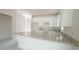 A bright kitchen featuring gray countertops and white cabinets at 303 E C St, Butner, NC 27509