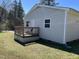 Outdoor view of a wooden deck and grey siding exterior with lawn at 3132 Fields Dr, Raleigh, NC 27603