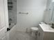 Modern bathroom featuring marble tile, new fixtures, tub and shower combination, and a sleek vanity at 3132 Fields Dr, Raleigh, NC 27603