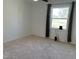 Bright bedroom with neutral carpet, freshly painted walls and natural light streaming through a large window at 3132 Fields Dr, Raleigh, NC 27603