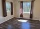Bedroom with hardwood floors and two windows offering natural light at 3132 Fields Dr, Raleigh, NC 27603