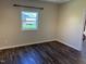 Bedroom featuring hardwood floors, a bright window and neutral-colored walls at 3132 Fields Dr, Raleigh, NC 27603