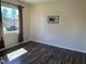 Charming bedroom with wood floors, a large window and a decorative piece at 3132 Fields Dr, Raleigh, NC 27603