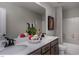 Well-lit bathroom featuring a double vanity with a modern faucet and stylish decorations at 33 White Azalea Way, Homesite 80, Benson, NC 27504
